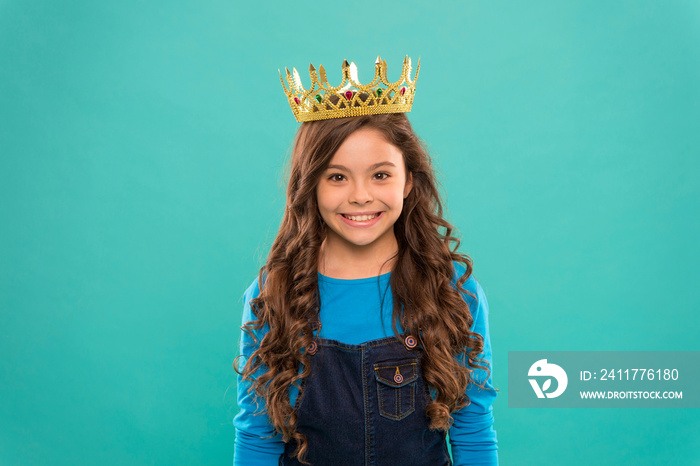 Gorgeous hair award. Kid wear golden crown symbol of princess. Girl cute baby wear crown blue background. Princess concept. Every girl dreaming to be princess. Little princess. Curly hairstyle