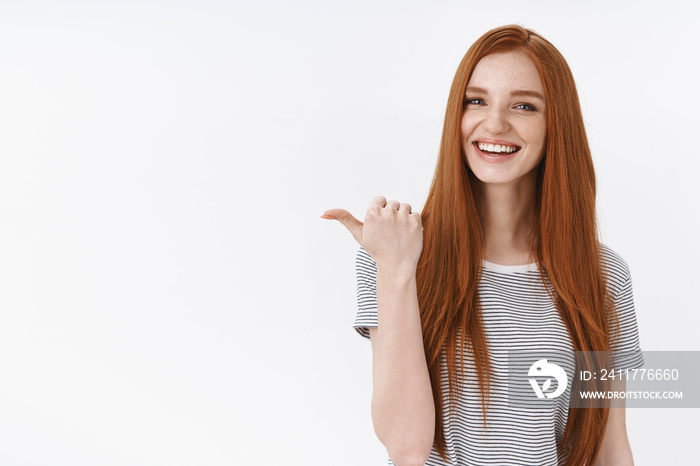 You better see it. Charming lively happy smiling redhead girl blue eyes pointing thumb left giving direction showing cool place hang out asking out friend drink coffee order take-away laughing