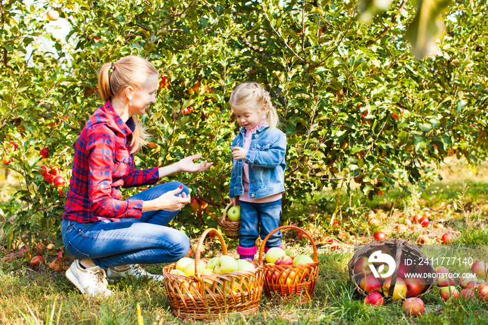 Woman and a girl at the orchard