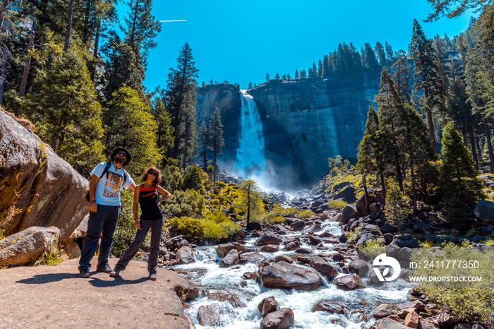 Long exposure at Vernal Falls from the bottom one summer morning and the sun above. California, United States.