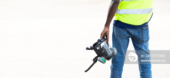 Officials from the Department of Hazardous substances control bureau is investigating the leak of a hazardous chemical at wearhouse container yard. African american or black people.