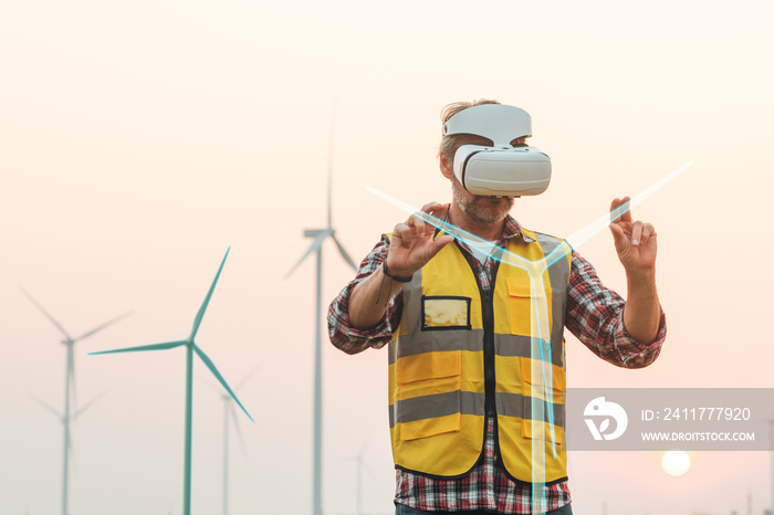 Senior engineer wearing AR goggle to virtualize adjustment wind turbine. Technology Virtual reality for wind turbine power energy industrial work space. Visualize Augmented technology.