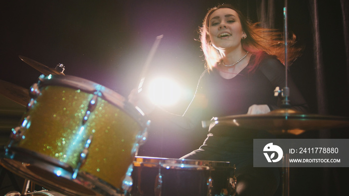 Passionate girl with long hair - percussion drummer perform music break down - teen rock music