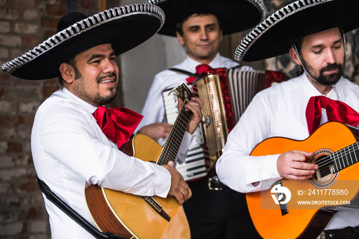 Mexican musicians in the studio, in the interior. Mexico, mariachi, artist, guitarist.