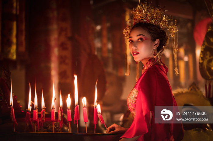 portrait of asian woman in traditional Chinese dress in Chinese shrine