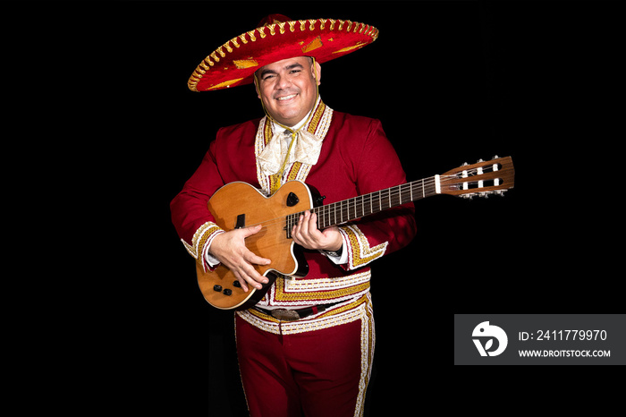 Mexican mariachi musician on a black background