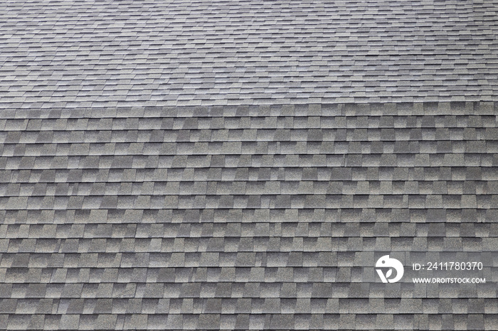 wet roof shingles background and texture. angle slop of asphalt roof.