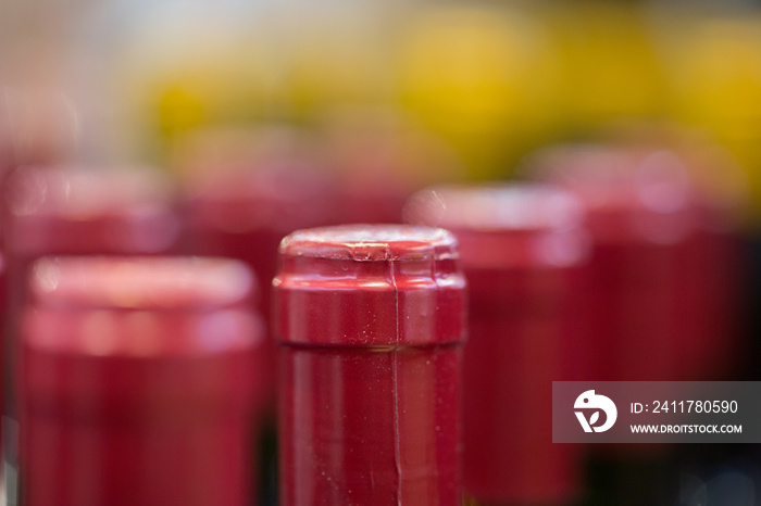 Close up of bottlenecks / red wine bottles