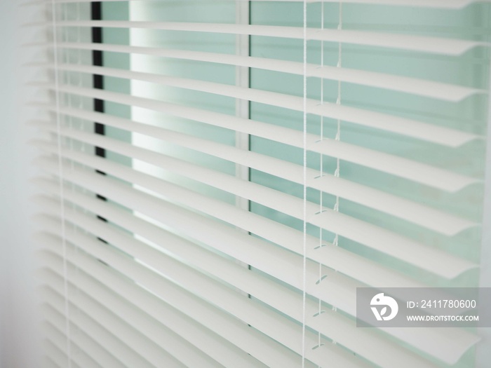 Home blinds - cordless cellular honeycomb pleated shade  automated curtains blind. Closeup photo, blurred.