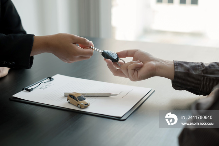 The car dealer provides advice on loans, insurance details, and car rental information, and delivers the car with the keys after the rental contract is signed