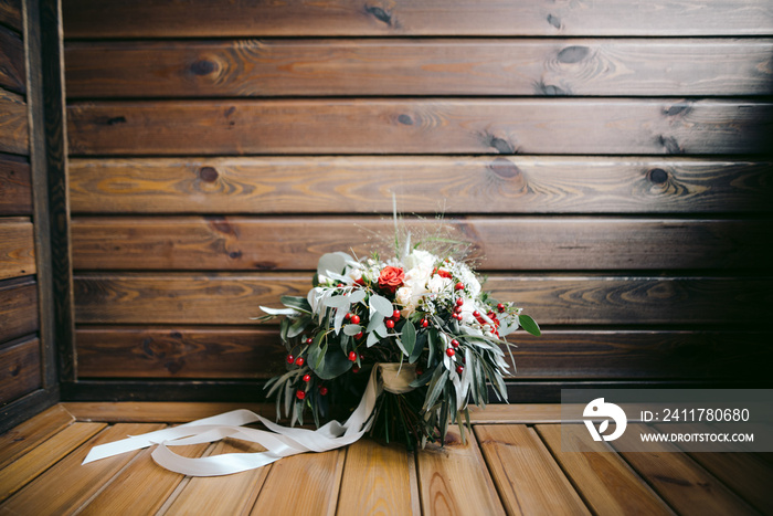 gorgeous weddin bouquet on a wooden balcony