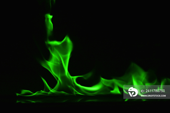 Beautiful fire green flames on a black background.