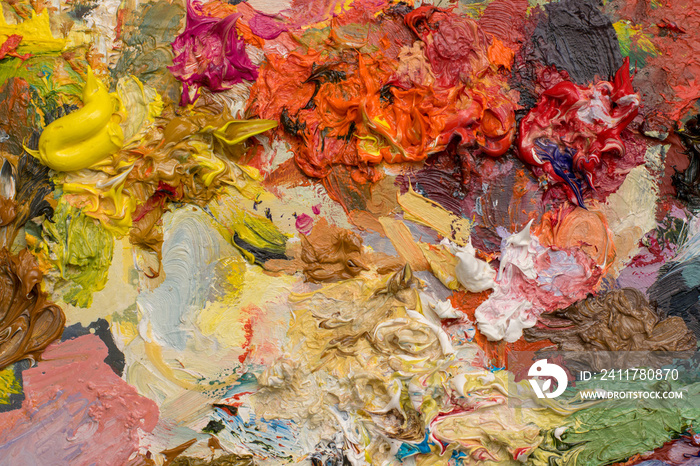 Background image of bright oil-paint palette close-up