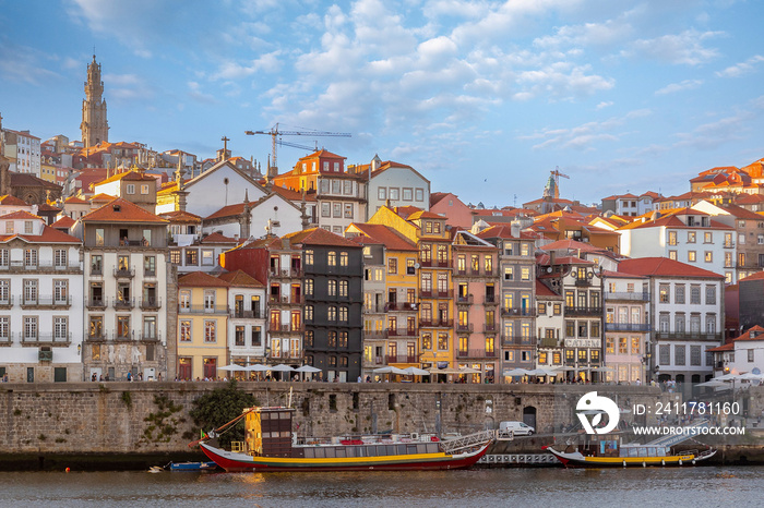 City of Oporto, Portugal in the margins of the Douro river. Douro river in the city of Oporto with traditional boats to transport the famous Oporto Wine from the wineries up river