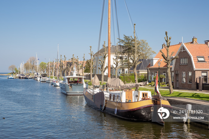 Harbor Dutch city Medemblik with old historical wooden sailing ship