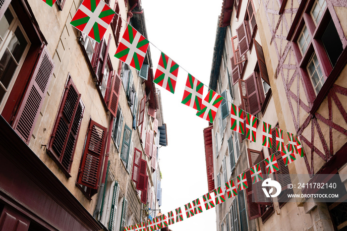bask flag on facades of old houses basque in Bayonne France