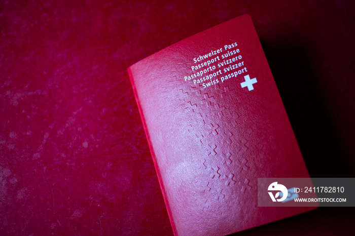 swiss passport on red background