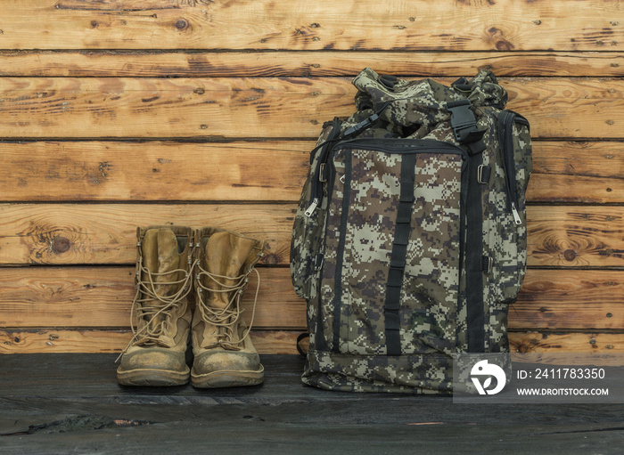 military backpack on a wooden table