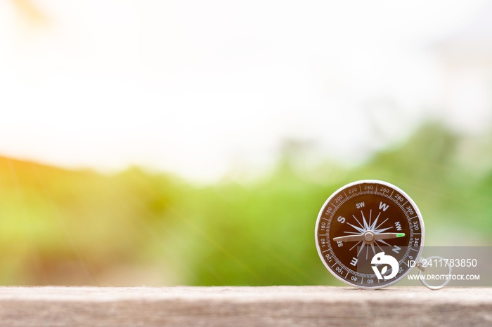 compass on the wooden desk in the morning. - for traveller concept