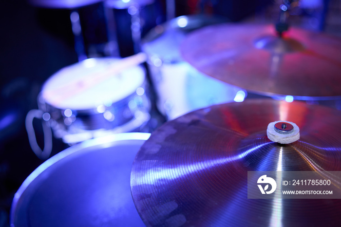 Set of drums. Detail of a drum kit closeup. The concept of a live concert. Drum set on rock concert stage. Professional musical instruments for drummer musician. Drumming instrument on rock festival.