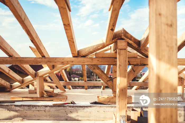 Domestic roof construction details with truss system and exterior beams.