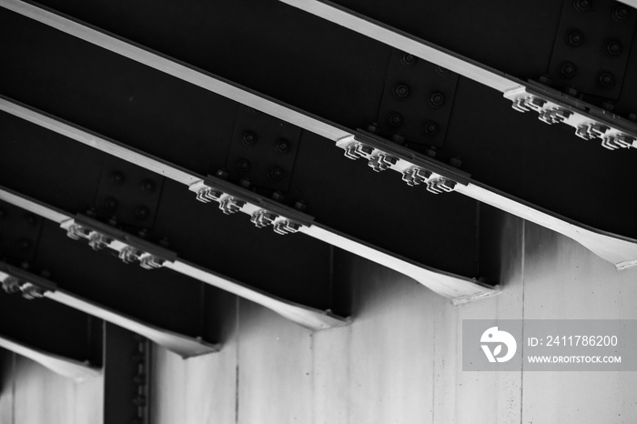 Steel bridge span, bottom view with girders connections. Black and white