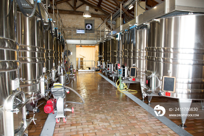 modern wine cellar with stainless steel tanks vats in Bordeaux region France