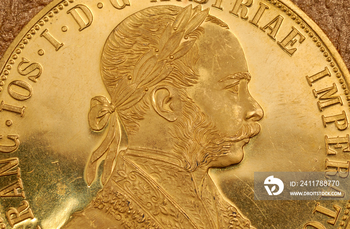 Portrait of Franz Joseph I on obverse of old gold Austrian four ducats coin.