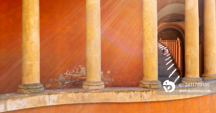 Interior view inside the Portico di San Luca, a monumental roofed arcade connecting Porta Saragozza with the San Luca Sanctuary, on Colle della Guardia in Bologna, Italy