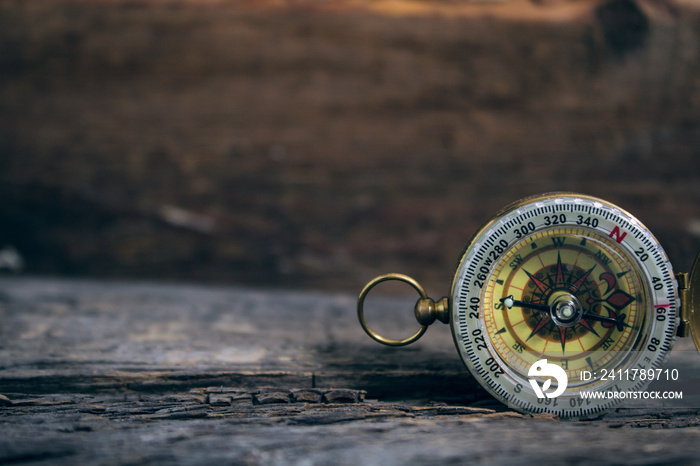 compass on an old wooden table