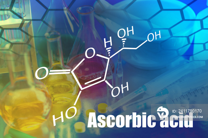 The inscription Ascorbic acid and chemical formula on the background of the pharmacological laboratory. Vitamins necessary for a person. Use of ascorbic acid in medicine. Vitamin C in cosmetology.