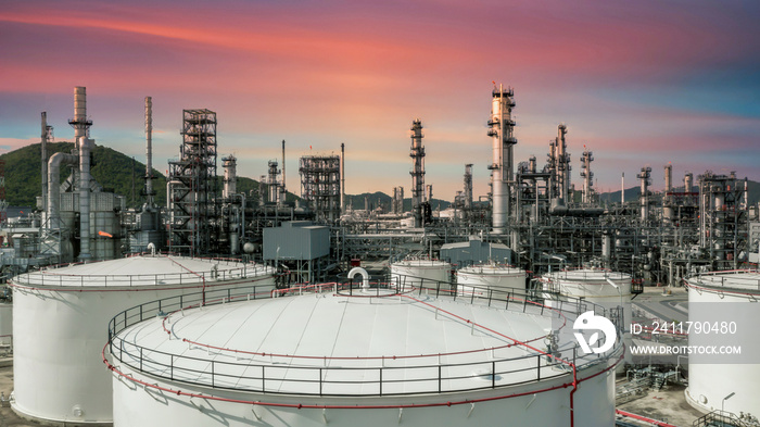 Oil refinery plant at industrial zone, Aerial view oil and gas business petrochemical industrial, Oil refinery factory white oil storage tank and pipeline steel, Ecosystem and healthy environment.