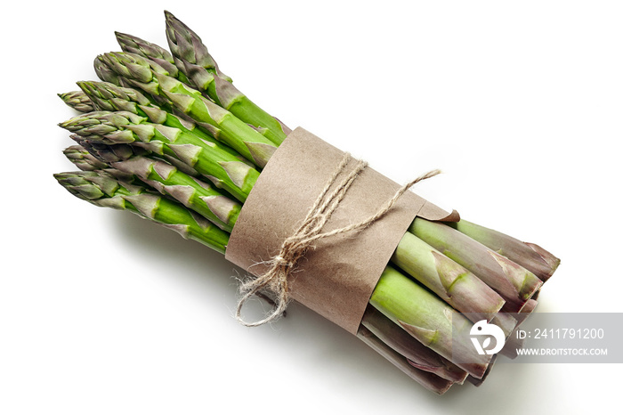 An edible, raw stems of asparagus isolated on white background.