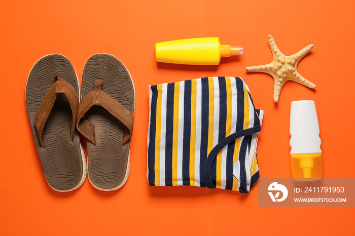 Set of male beach accessories on color background