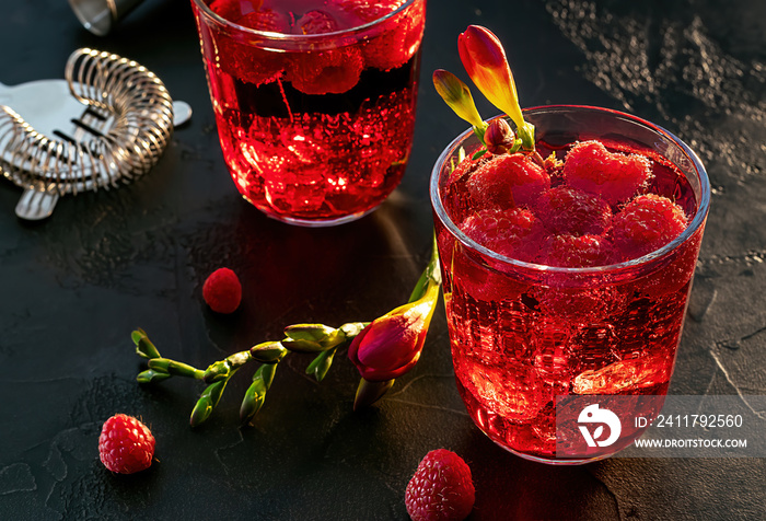 Sweet raspberry vodka cocktail with ice. Refreshing summer drink