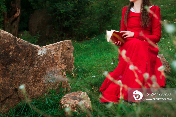 girl reading a book in the park