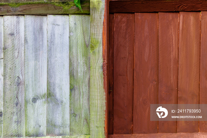Painting old wooden fence with a brown paint, renovation concept. Before and After image