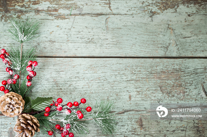 Christmas decoration of mistletoe, holly with berries,ivy and pine cones