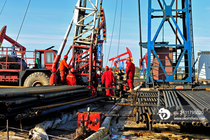 Oil field oil workers at work