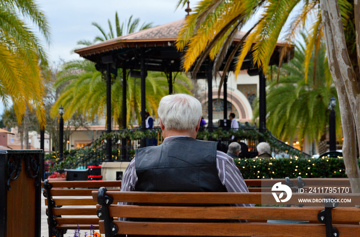 Retired Man Sitting Alone at Concert in Retirement Community in Florida