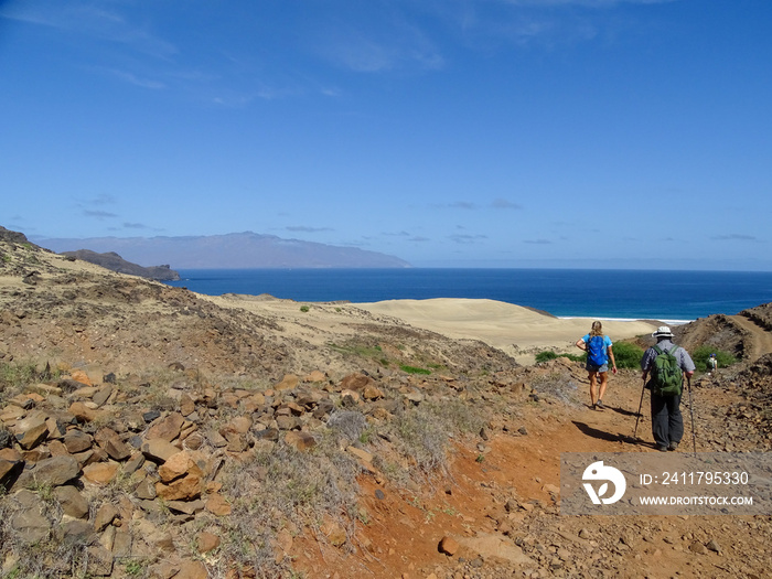 Group of people, hiking in Cape Verde, Sao Vicente island, warm summer day.