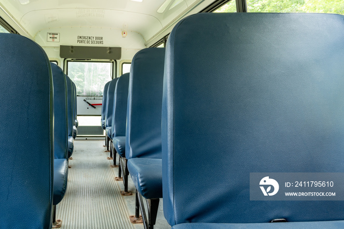 Empty Blue School Bus Seats Rear View