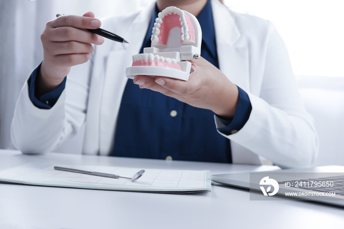 Dentist explaining process of treatment to patience, medical health concept