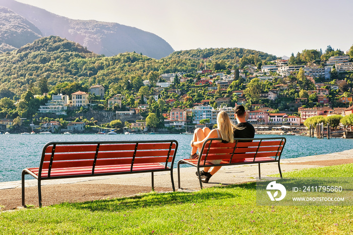 Couple sitting on bench in Ascona in Ticino of Switzerland