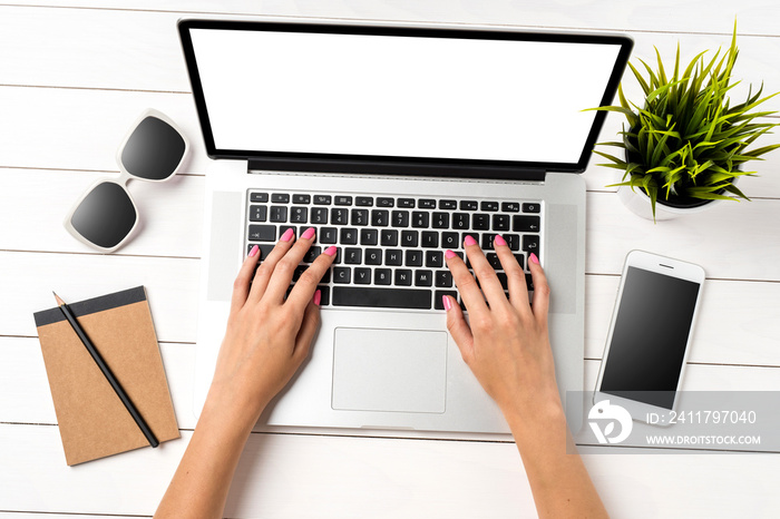 Woman using modern white laptop in office. Top view