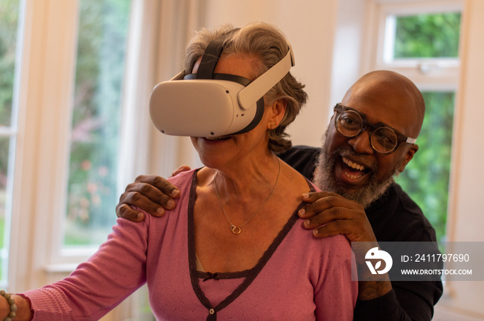 Senior couple having fun with VR set