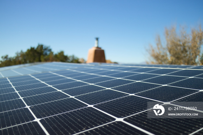 Close shot of a solar panel installation on a rooftop, in horizontal format