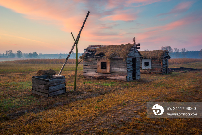 Sunrise over the wooden huts in Lesznowola near Piaseczno, Poland