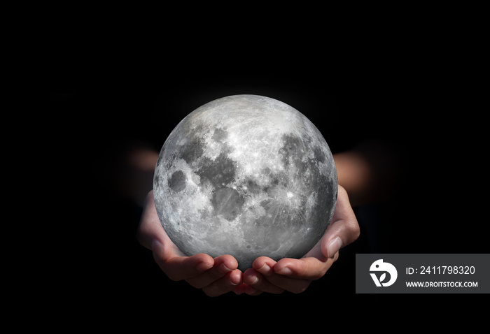 Moon in hands. The stars that are followers of the world on hand. save of moon. environment concept for background web or world guardian organization.Elements of this image furnished by NASA