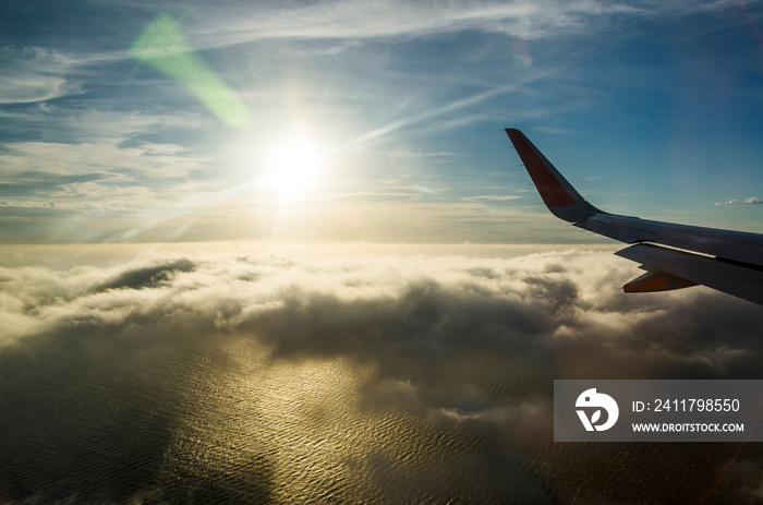 Flying above the clouds, view from the airplane